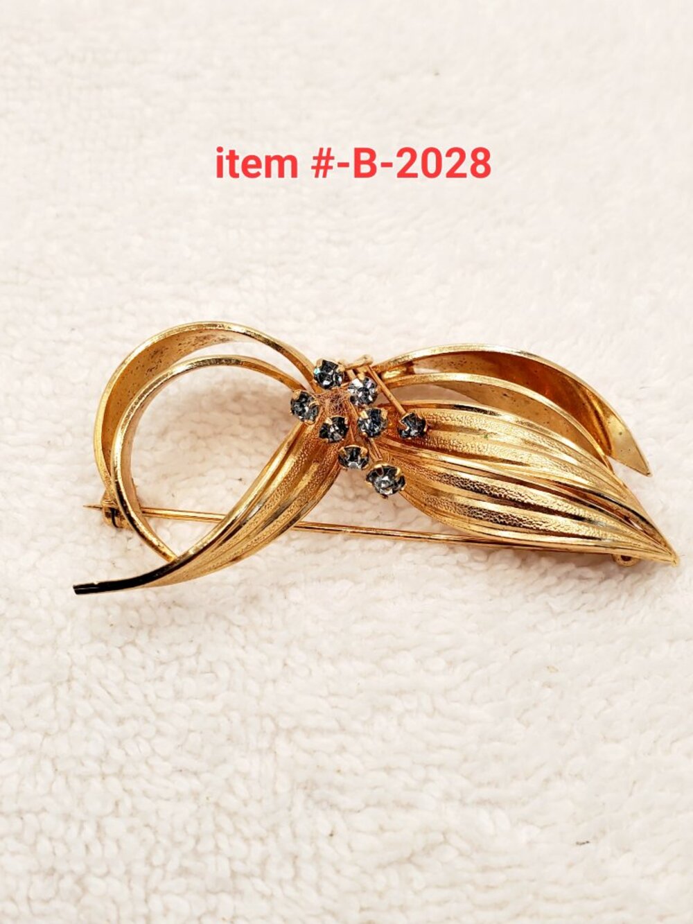1 Brooch, item # B- 2028,  wt. 18 grams.